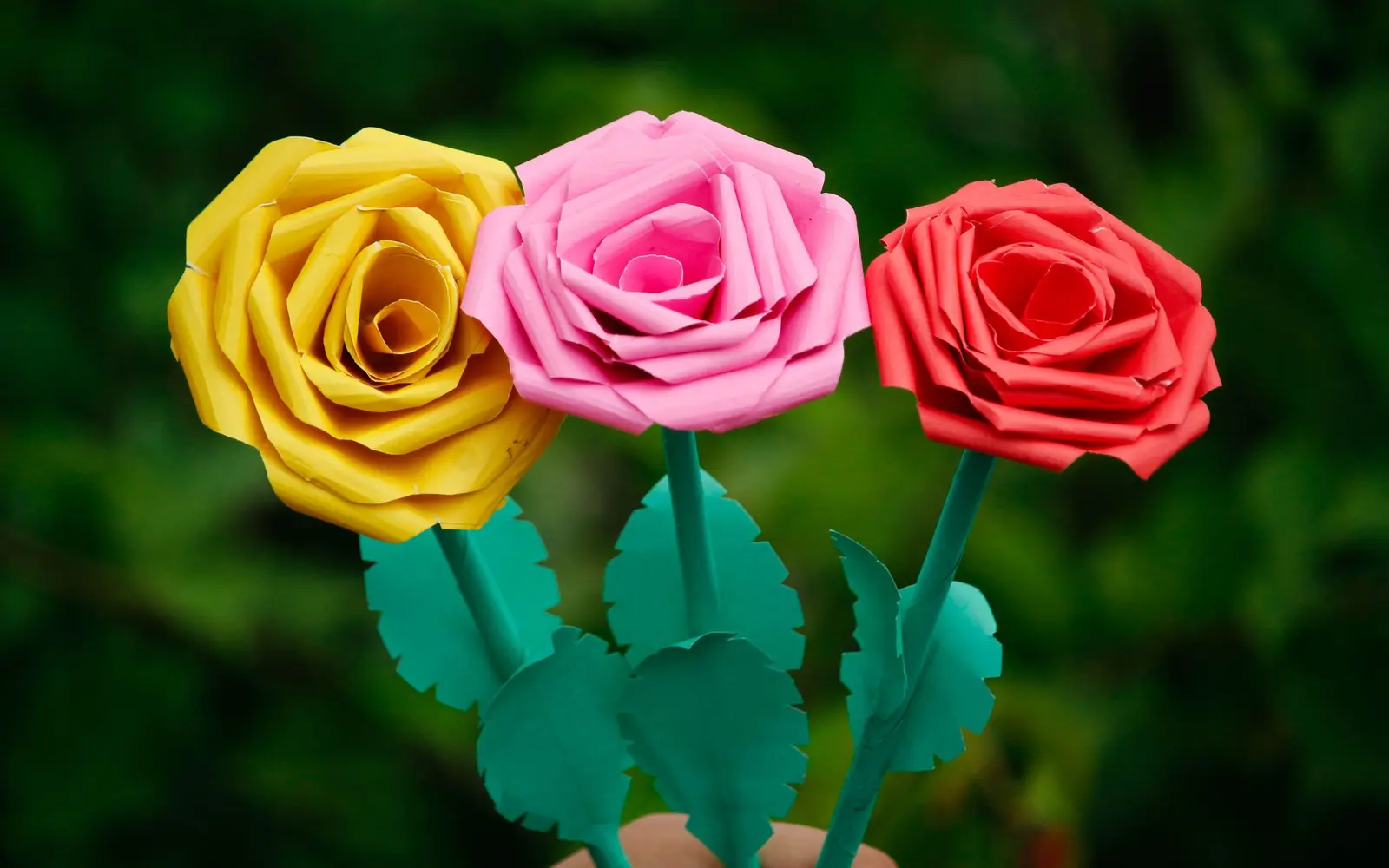 Handmade yellow, pink and red paper roses