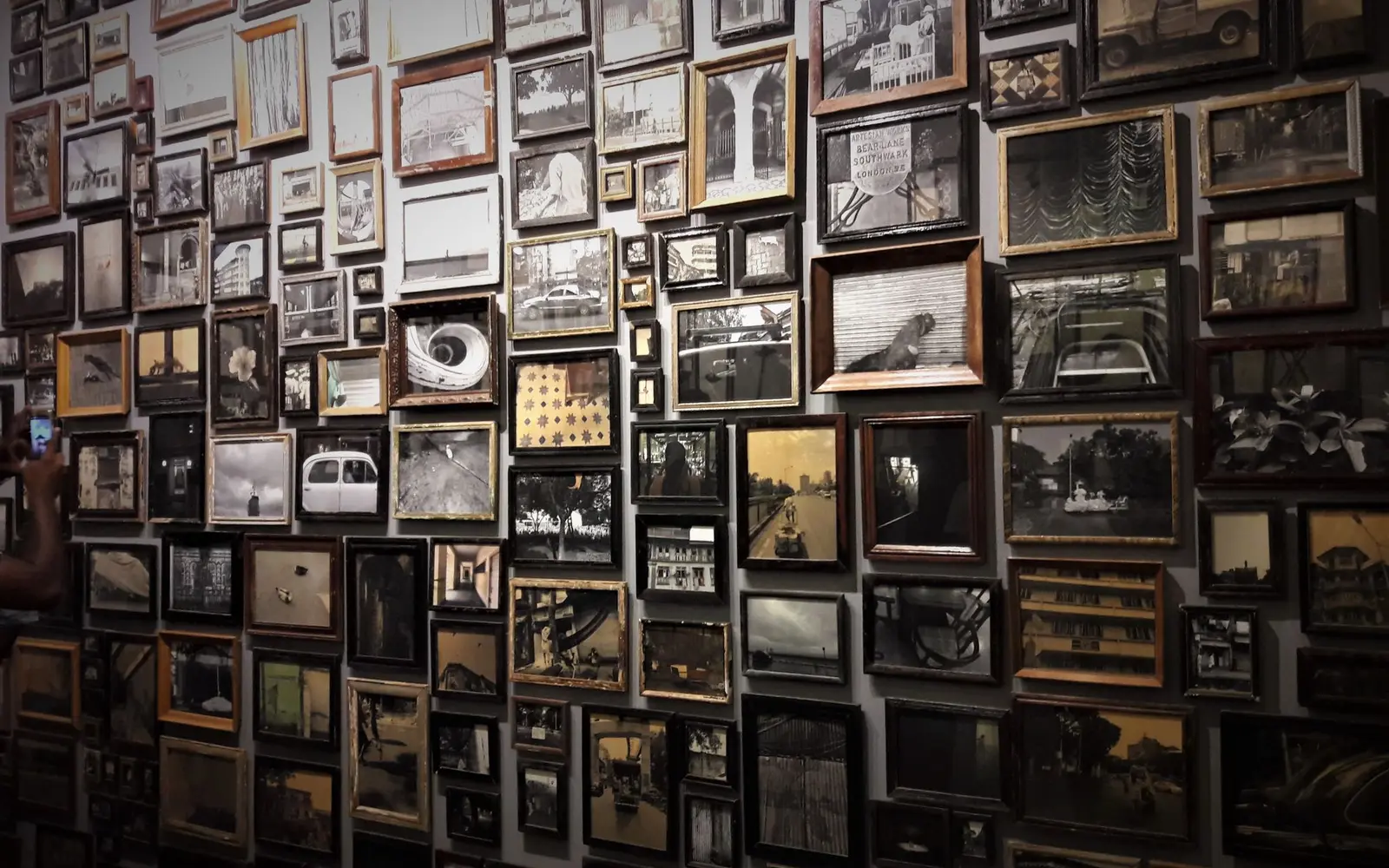 Wall covered in a mix of vintage picture frames